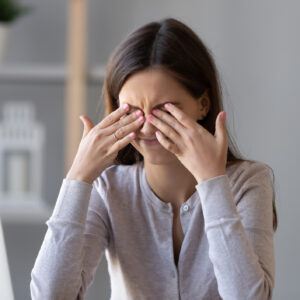 Tired teen girl rubbing dry irritable eyes feel eyestrain tension